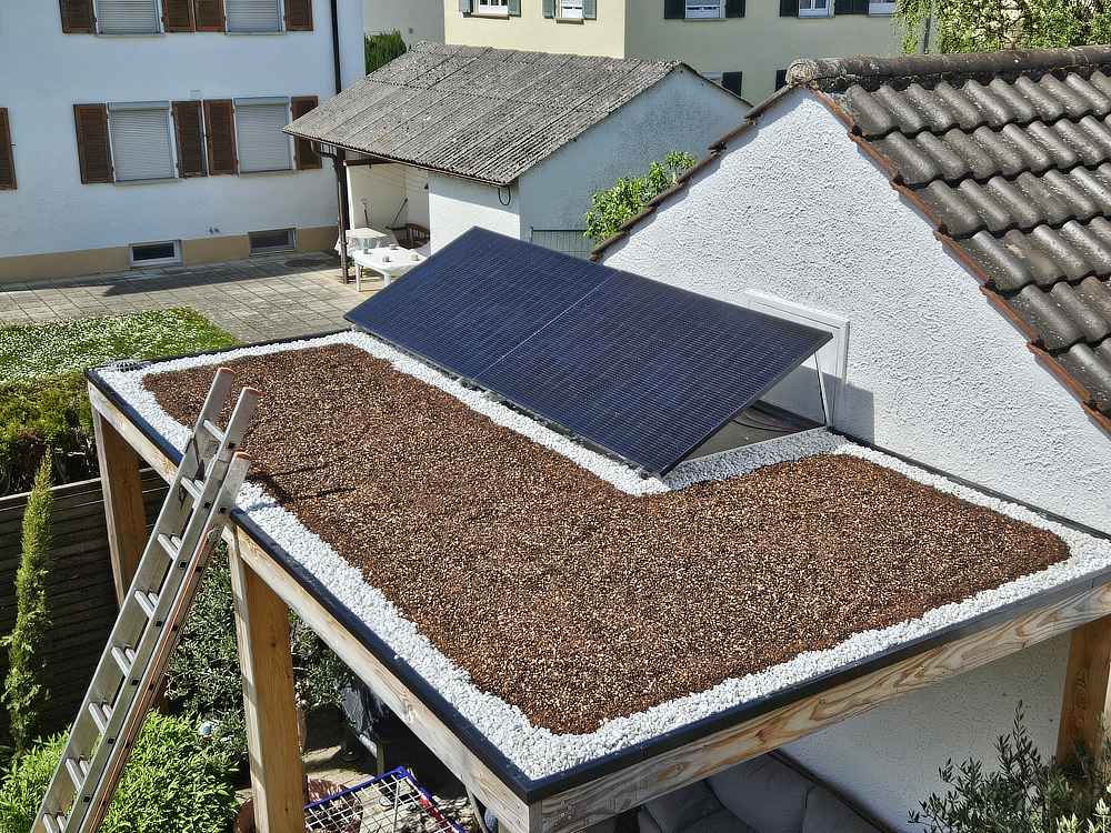 Flachdach-Garagenbegruenung-Carport-Pflanzen-Schritt3-Erde-und-Randsteine